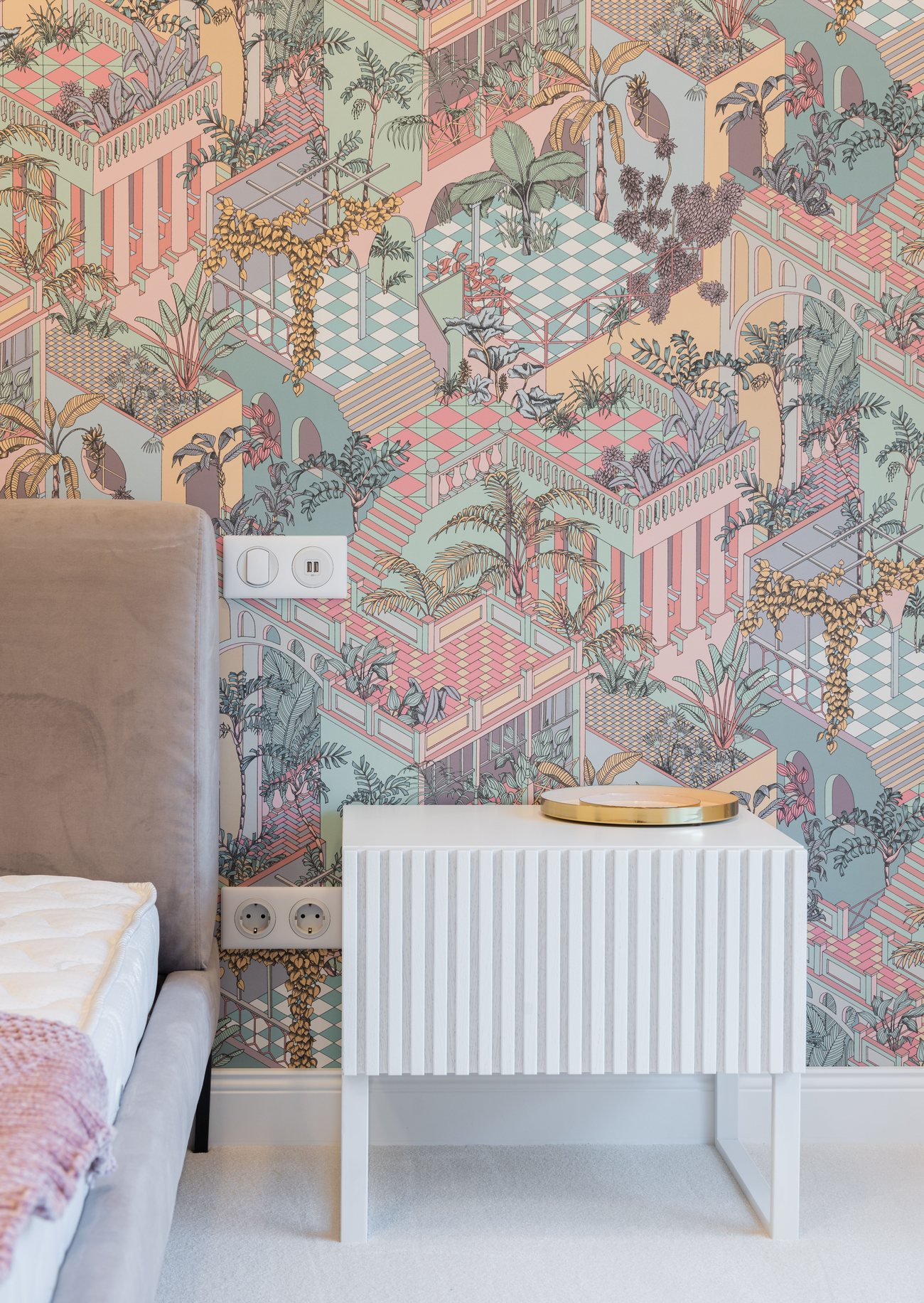 Bedroom mural wallpaper detail in a soft, layered pastel pattern