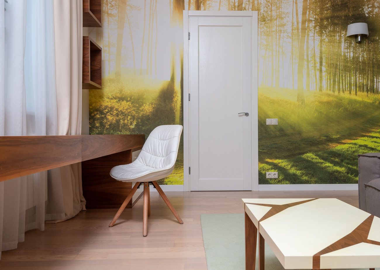 Home office accent wall finished in a scenic mural wallpaper